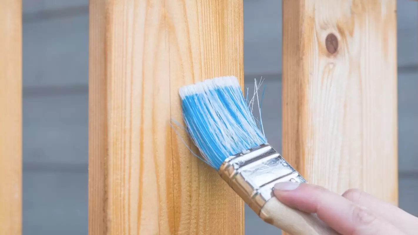 Uplift the beauty with our fence staining services!
