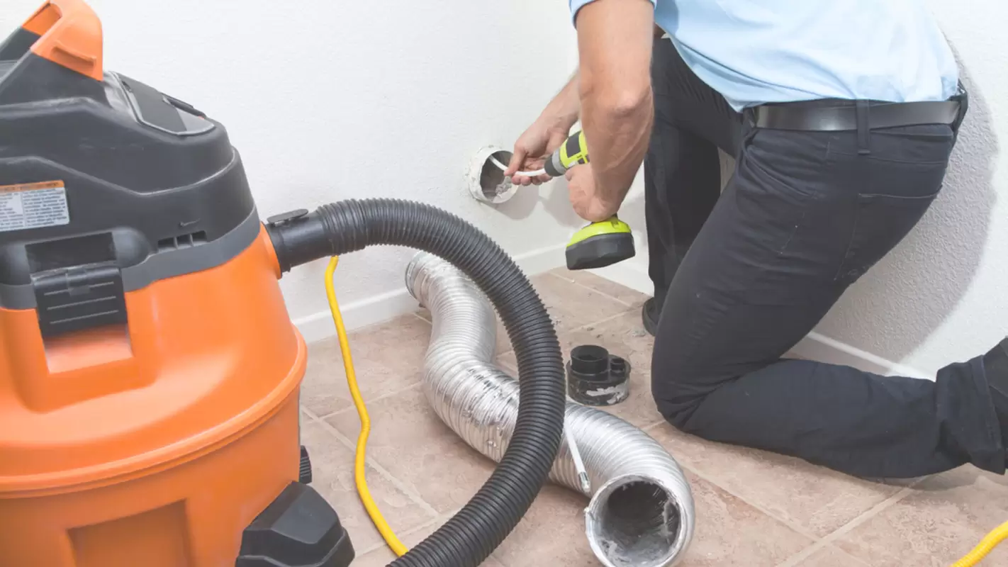 Clear the lint using a dryer vent cleaning service