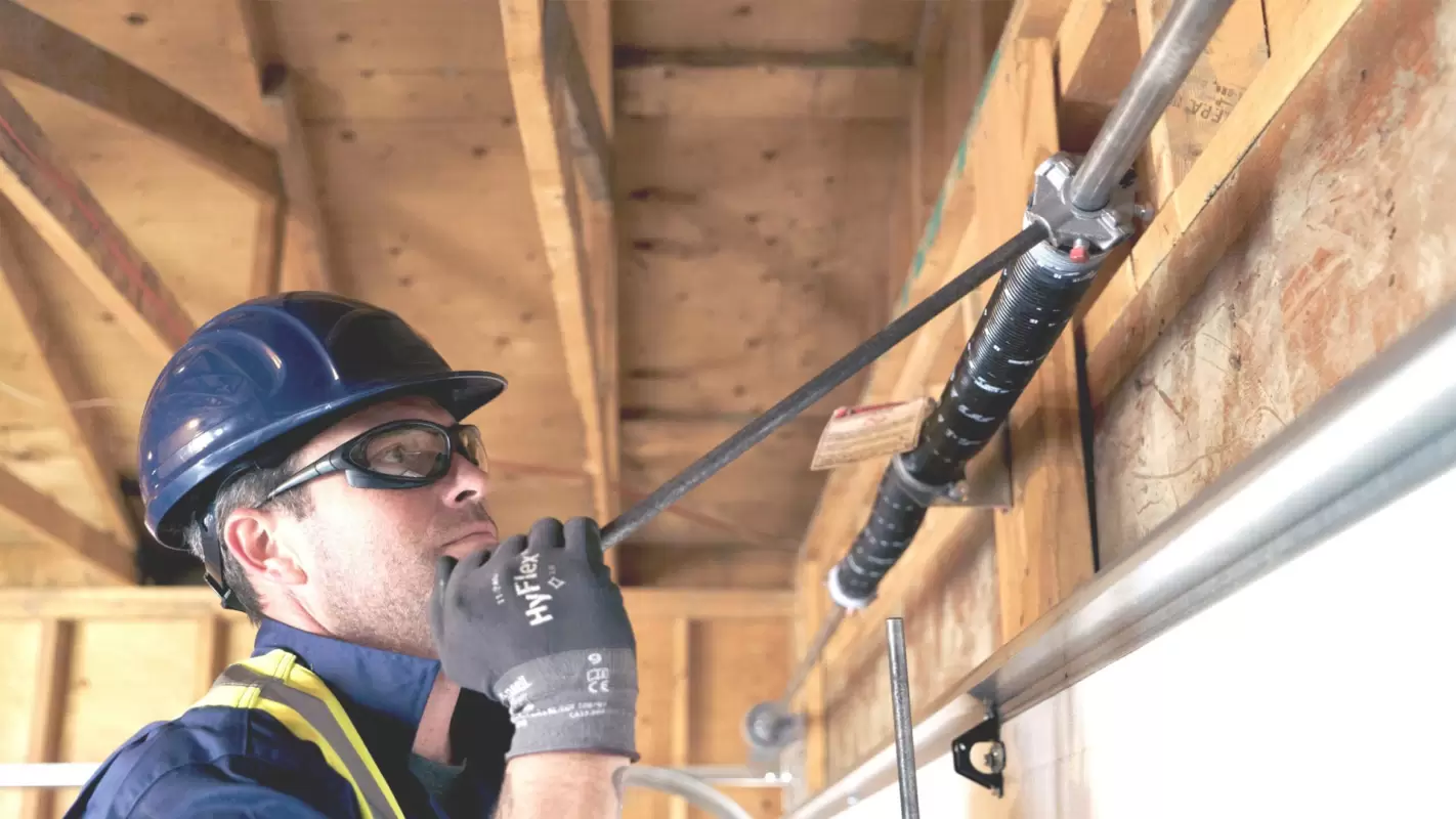 Garage Door Spring Repair to Prevent Door Staining & Costly Repairs!