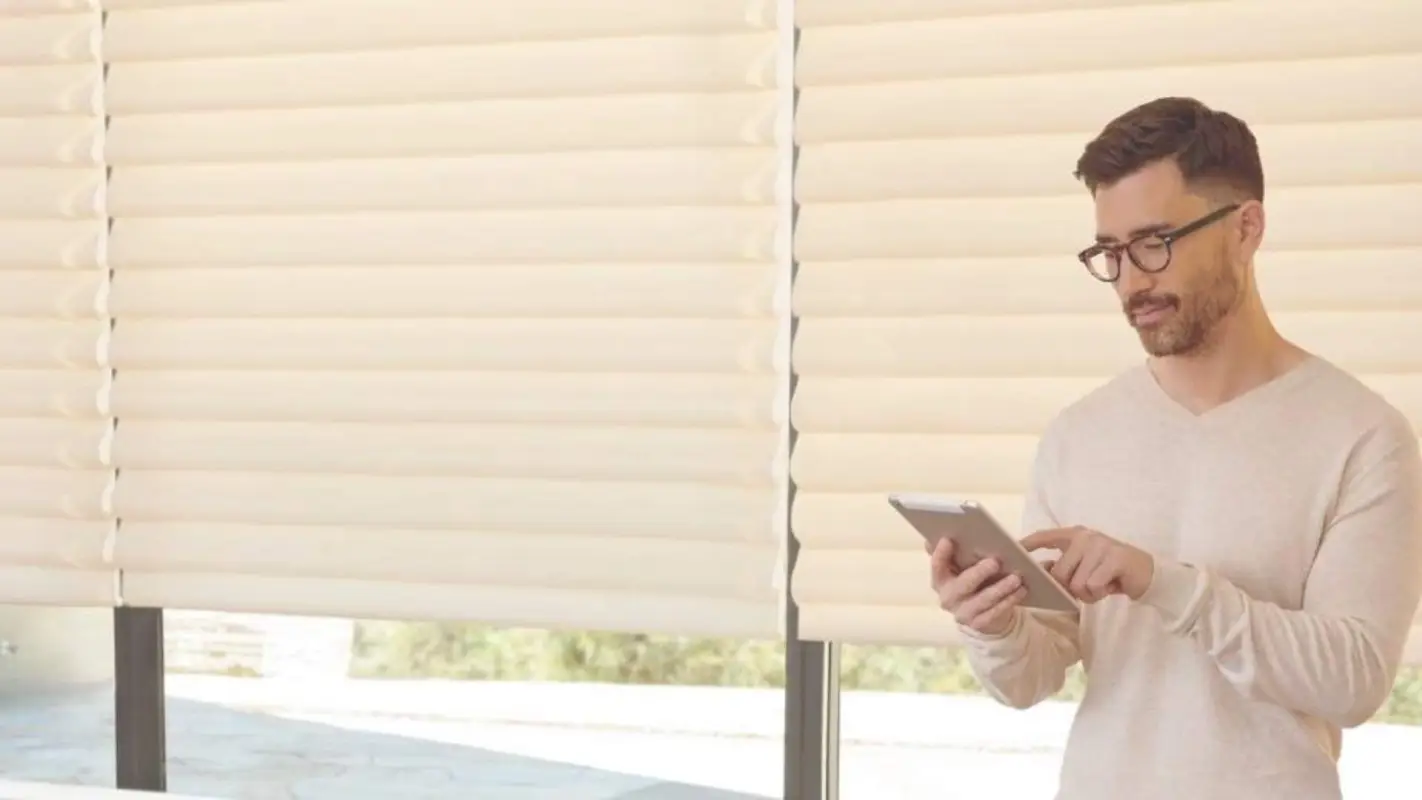 Push of a button brings comfort with our Motorized shades services